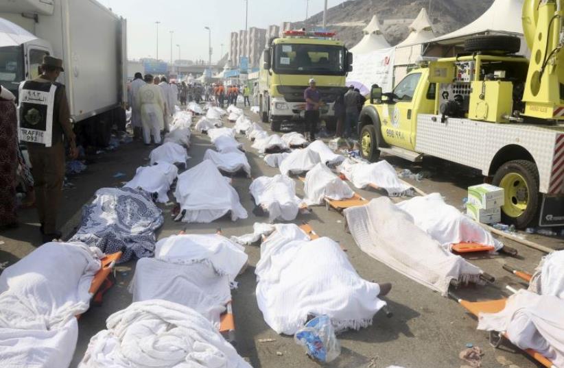 Bodies of Muslim pilgrims are seen after a stampede at Mina, outside the holy Muslim city of Mecca (photo credit: REUTERS)