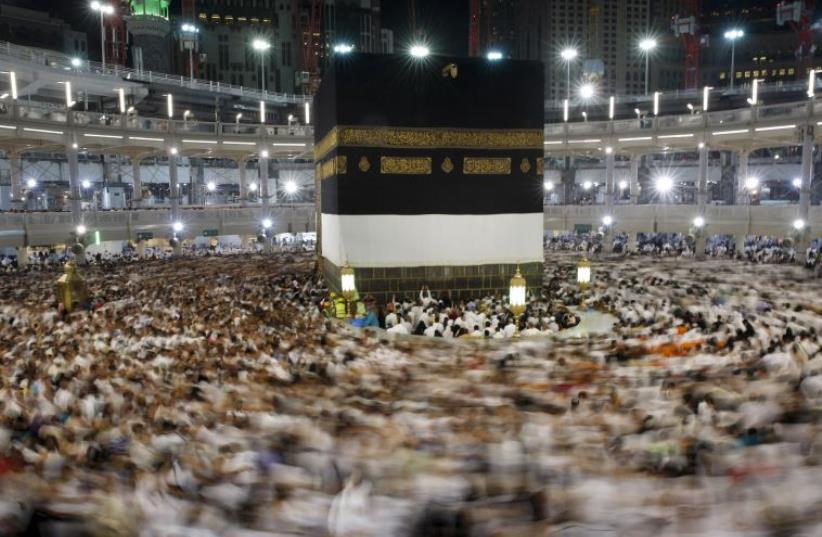 Muslim pilgrims pray around the holy Kaaba at the Grand Mosque ahead of the annual haj pilgrimage in Mecca (photo credit: REUTERS)