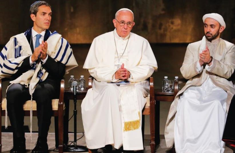 POPE FRANCIS sits with Rabbi Elliot J. Cosgrove and Iman Khalid Latif, Executive Director of the Islamic Center and chaplain to the students at New York University, during a multi-religious gathering at the National September 11 Memorial Museum in New York last week. (photo credit: REUTERS)