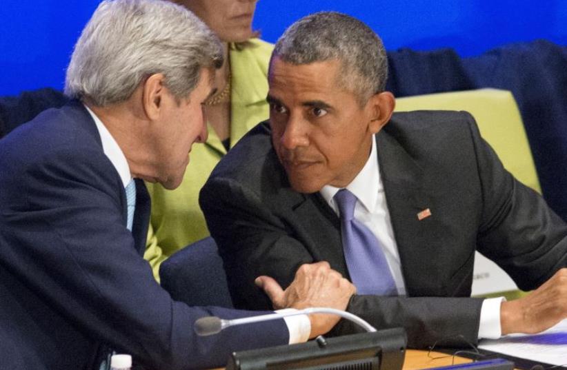 US Secretary of State John Kerry (L) speaks to US President Barack Obama (R) during the Leaders' Summit on Countering ISIL and Violent Extremism at the UNGA September 29, 2015.  (photo credit: REUTERS)