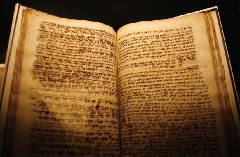 AN ANCIENT Hebrew text is displayed at a museum. Was the patriarch Abraham one of the first Jewish lawyers, wonders the author. (photo credit: REUTERS)