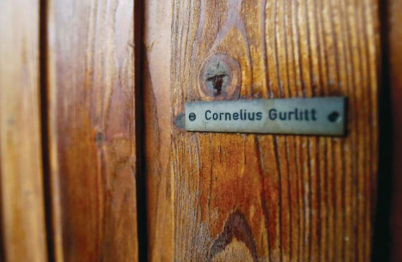 The nameplate on the house of art collector Cornelius Gurlitt is pictured in Salzburg in 2013 (photo credit: DOMINIC EBENBICHLER/REUTERS)