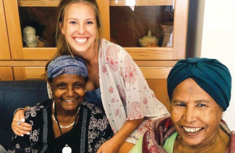 A ‘Zealous8:2’ project participant visits an Ethiopian community center as part of her service (photo credit: Courtesy)