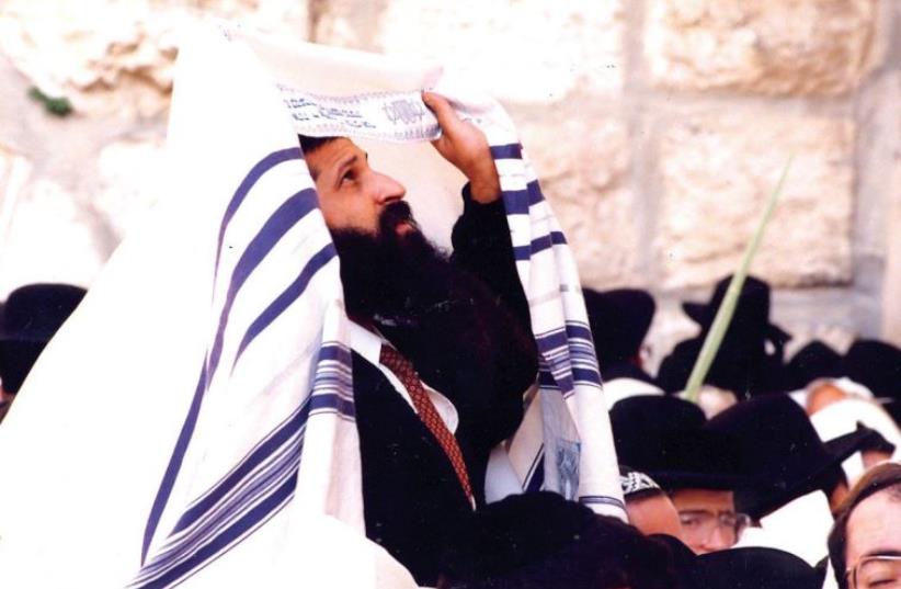 Prayers at the Western Wall during Succot, 1997. Jews from all over Israel and around the world have converged upon Jerusalem to rejoice in the festival (photo credit: BRYAN MCBURNEY)