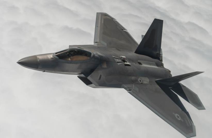 An F-22A Raptor flies a training sortie over Nevada (photo credit: UNITED STATES AIR FORCE)