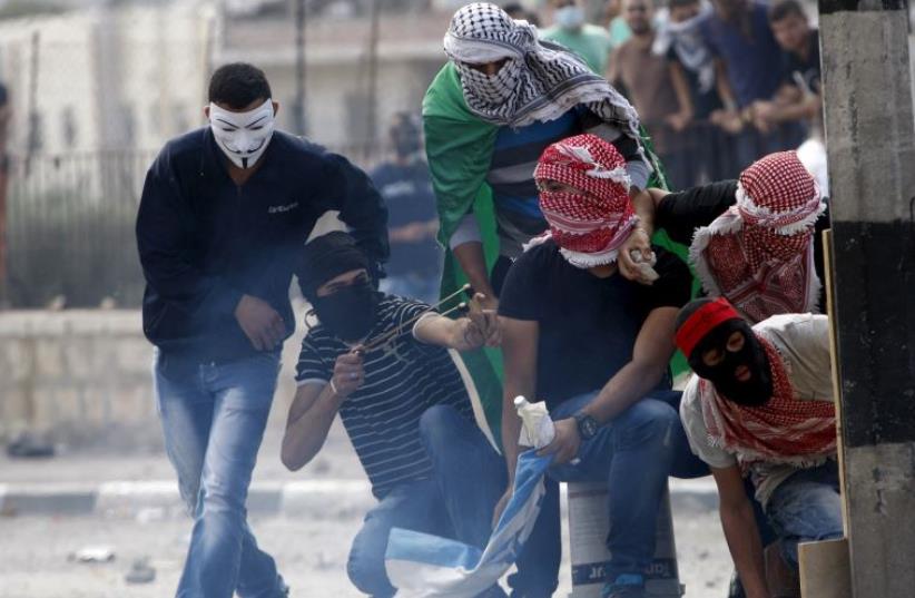 Palestinian rock-throwers attack Israeli troops near Bethlehem (photo credit: REUTERS)