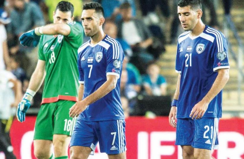 Israel national team players Ofir Martziano (left), Eran Zahavi (center) and Eitan Tibi (right) couldn’t hide their disappointment (photo credit: ASAF KLIGER)