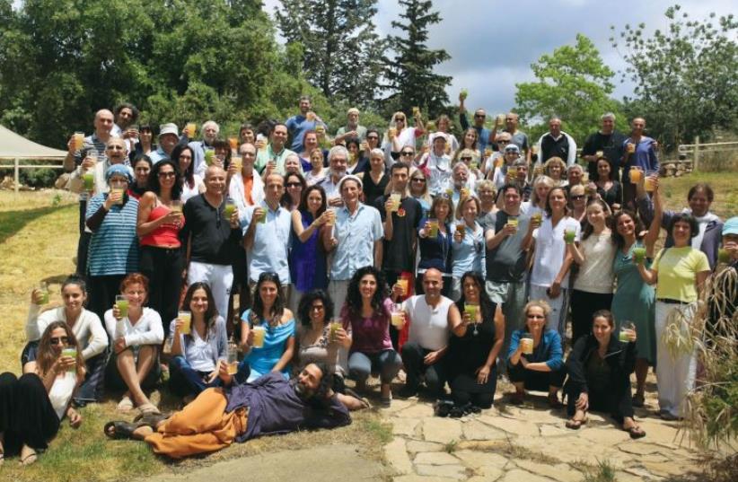 Participants raise their juice fast glasses at the Tree of Life seven-day fast at the Dead Sea (photo credit: TREE OF LIFE)