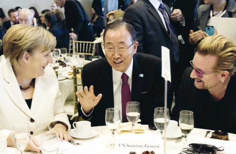 UN Secretary General Ban Ki-moon hosts German Chancellor Angela Merkel and Bono, musician and human rights activist, at the Private Sector Forum on September 26 (photo credit: UN)