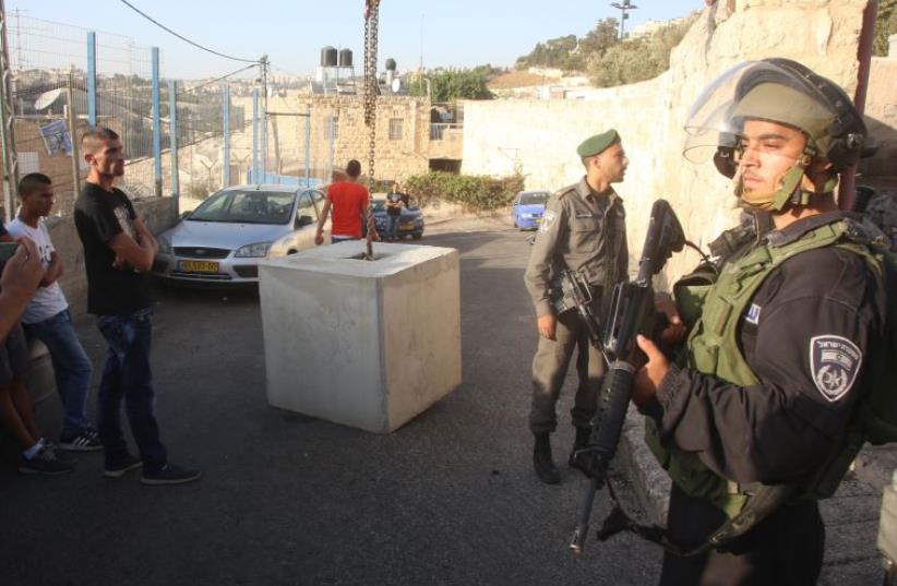 Concrete barriers set up in east Jerusalem neighborhoods (photo credit: MARC ISRAEL SELLEM/THE JERUSALEM POST)