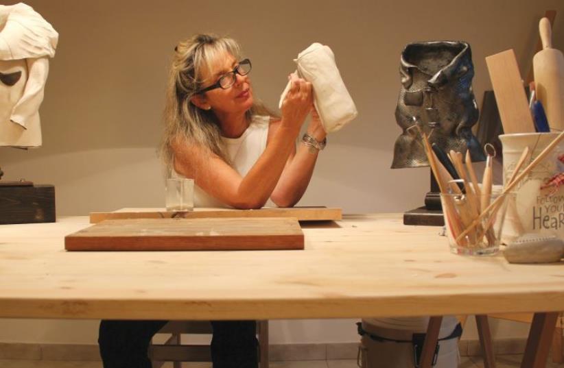LOCAL SCULPTOR Anita Birkenfeld works from her studio at home on her latest exhibit ‘Out of Style.’ (photo credit: Courtesy)