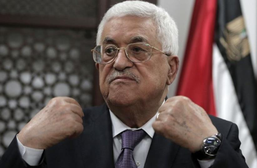 Palestinian Authority President Mahmoud Abbas speaks with journalists at his office in the West Bank city of Ramallah (photo credit: AFP PHOTO)
