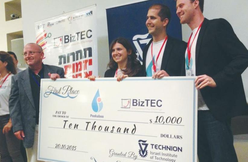 PEEKABOO’S FOUNDERS accept a $10,000 check for first prize at the BizTEC accelerator competition at the Microsoft R&D center in Herzliya yesterday. (photo credit: NIV ELIS)