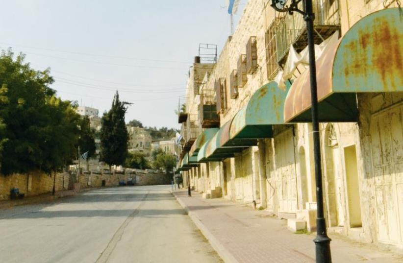 Upper Shuhada Street leading from the Avraham Avinu Jewish community to Beit Hadassah (photo credit: LAURA KELLY)