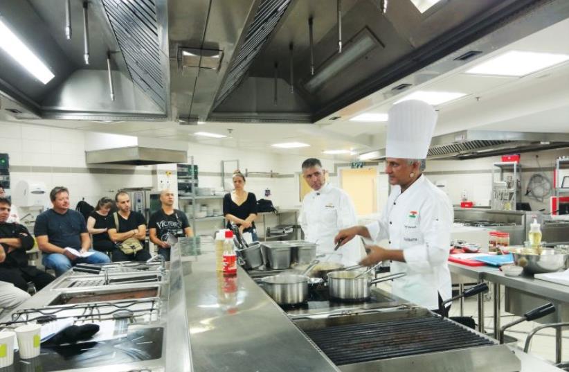Suresh Mathpal teaches a class at the Dan Gourmet culinary school in Tel Aviv last week (photo credit: AMY SPIRO)