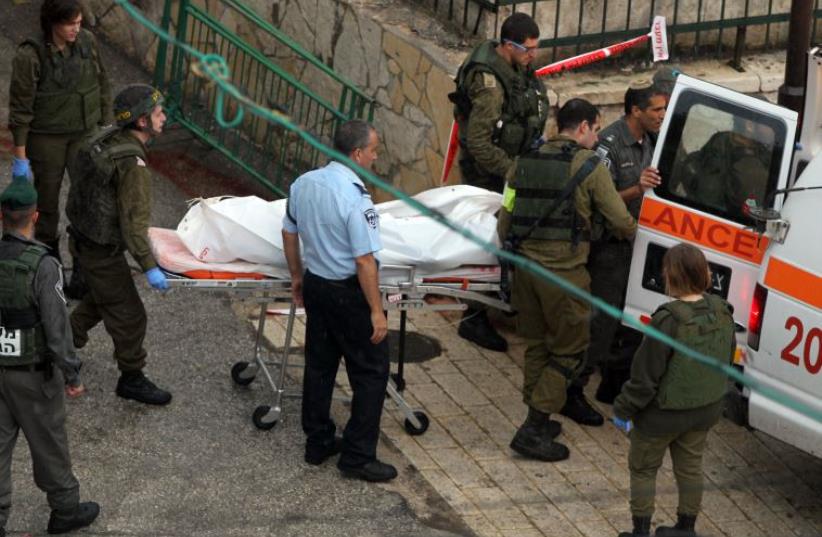 Terrorist shot dead after attempting to stab police at Cave of the Patriarchs (photo credit: HAZEM BADER / AFP)