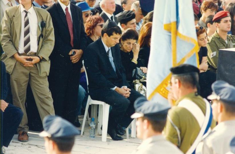 Yuval Rabin next to his mother Leah at his father’s funeral on November 6, 1995 (photo credit: JERUSALEM POST ARCHIVE)