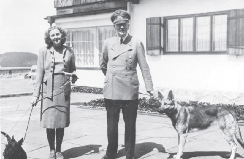Adolf Hitler and Eva Braun with their dogs at the Berghof, his home in the Bavarian Alps (photo credit: Wikimedia Commons)