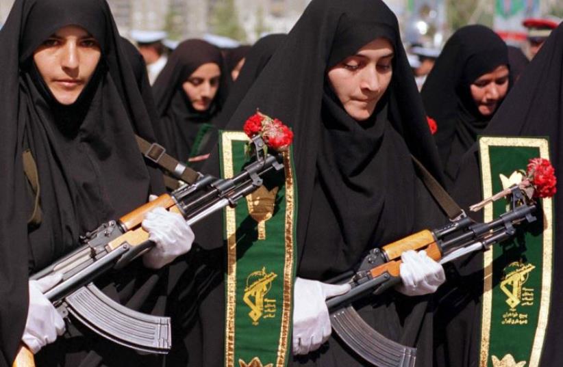 Iranian women mark the 20th anniversary of the start of the Iran-Iraq war during a military parade (photo credit: REUTERS)