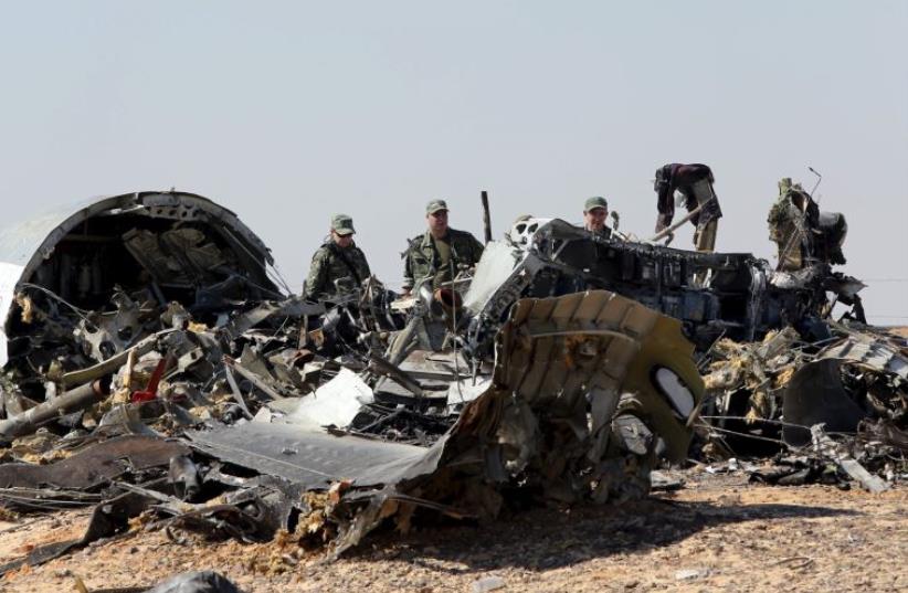 Russian airliner at its crash site at the Hassana area in Arish city, north Egypt (photo credit: REUTERS)