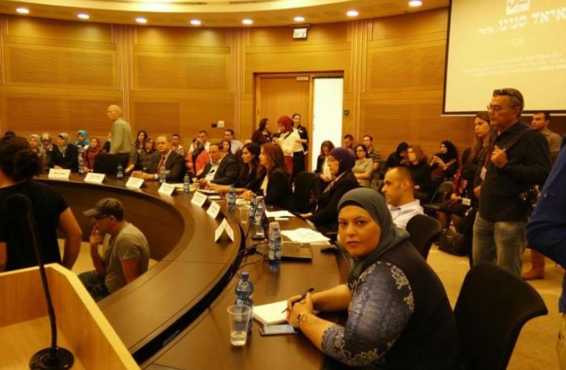 NAGAM NASRALLAH (foreground), coordinator of the Abraham Fund’s youth employment initiative, attends a conference at the Knesset yesterday about the problem of high unemployment among Arab women. (photo credit: COURTESY ABRAHAM FUND)