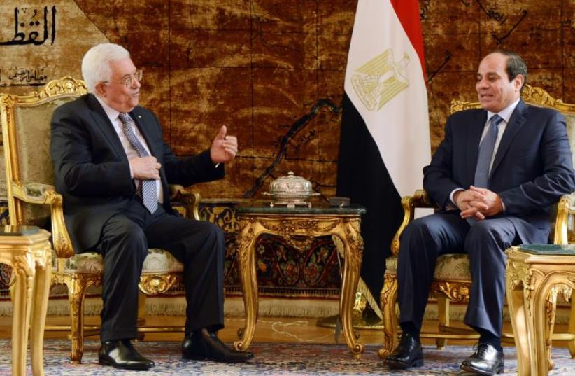 Egyptian President Abdel Fattah al-Sisi (R) meeting with Palestinian Authority President Mahmud Abbas in the Egyptian capital Cairo on November 8 (photo credit: AFP PHOTO)