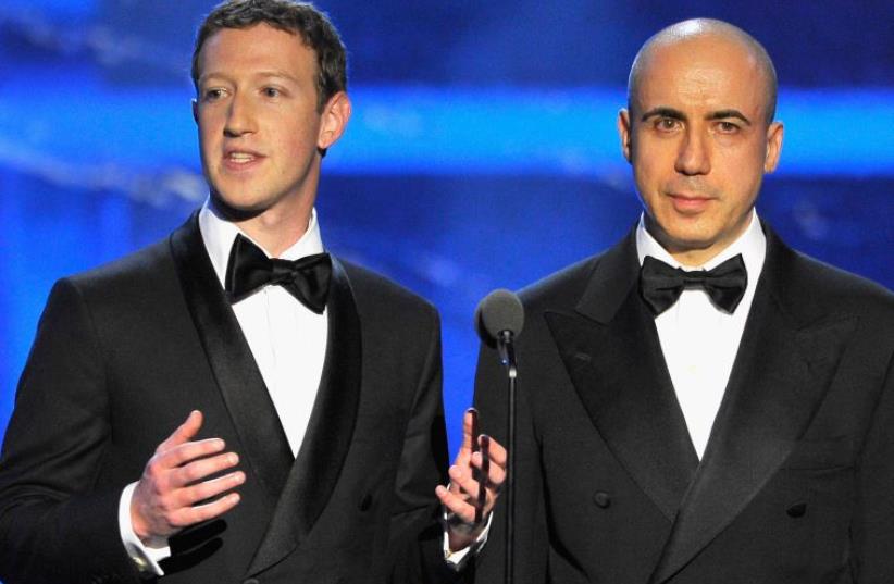 Mark Zuckerberg (L) and Yuri Milner speak onstage during the 2016 Breakthrough Prize Ceremony on November 8, 2015 in Mountain View, California (photo credit: STEVE JENNINGS/GETTY IMAGES FOR BREAKTHROUGH PRIZE)