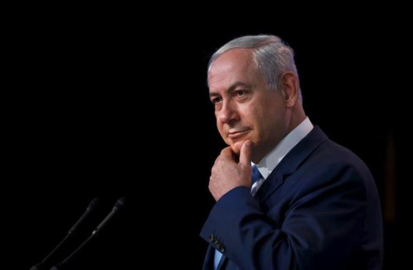 Israeli Prime Minister Benjamin Netanyahu pauses as he delivers a speech at the Jewish Federations of North America 2015 General Assembly in Washington November 10, 2015. (photo credit: REUTERS)