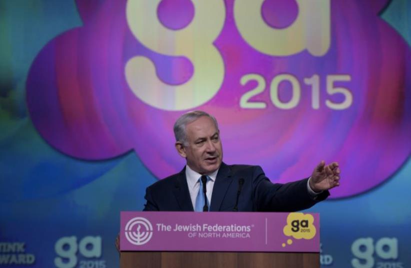 PM Netanyahu addresses the Jewish Federations of North America's 2015 General Assembly November 10, 2015 in Washington, DC (photo credit: BRENDAN SMIALOWSKI / AFP)