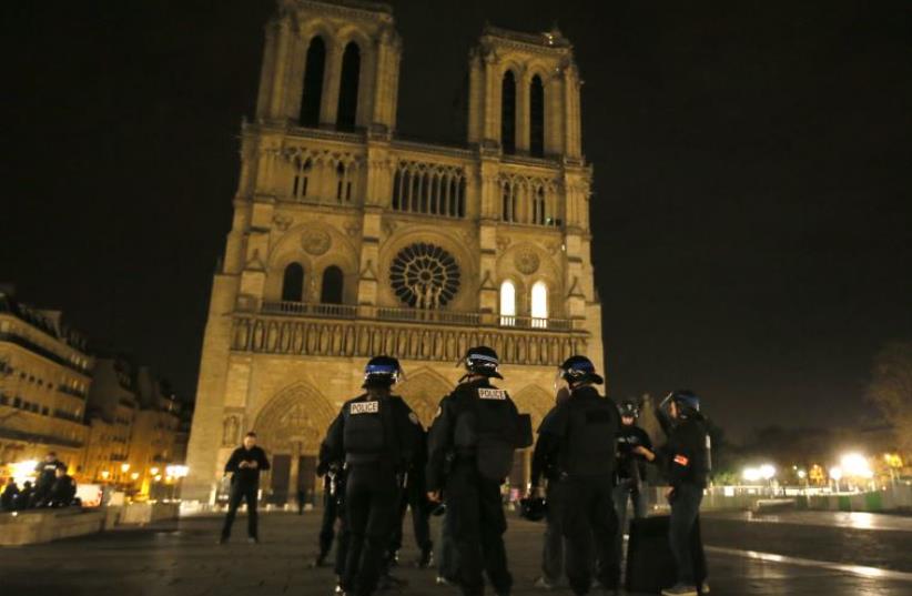 Police patrol near Notre Dame Cathedral following a series of deadly attacks in Paris , November 14, 2015 (photo credit: REUTERS)