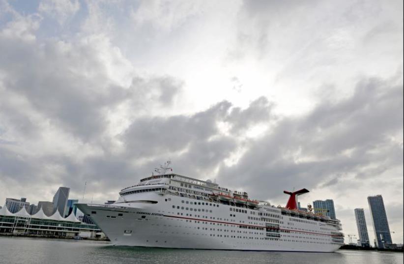 The Carnival cruise ship Ecstasy leaves the port in Miami, Florida (photo credit: REUTERS)
