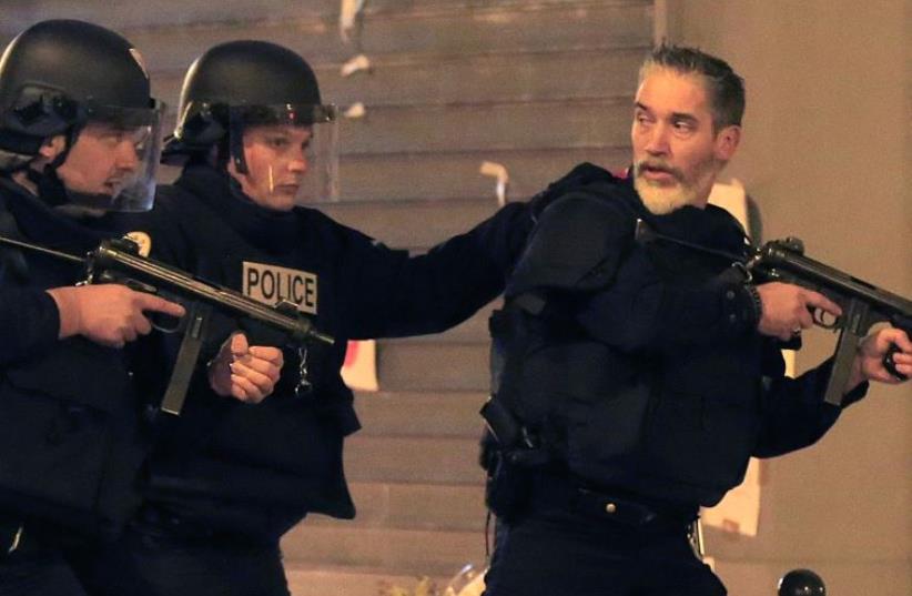 French Police in action following a series of deadly attacks in Paris (photo credit: REUTERS)