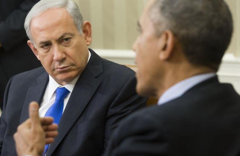 Prime Minister Benjamin Netanyahu (L) listens to US President Barack Obama in the Oval Office (photo credit: AFP PHOTO)