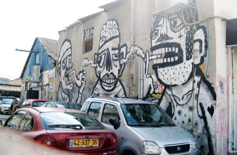 A typical wall in Tel Aviv’s Florentin neighborhood (photo credit: CARL HOFFMAN)