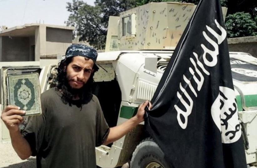 An undated photograph of a man described as Abdelhamid Abaaoud that was published in the Islamic State's online magazine Dabiq and posted on a social media website (photo credit: REUTERS/ISLAMIC SOCIAL MEDIA)