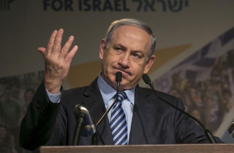 Prime Minister Benjamin Netanyahu gestures as he give an address (photo credit: REUTERS)