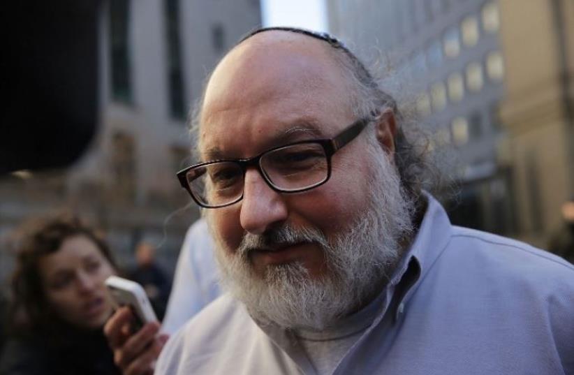 Israeli spy Jonathan Pollard leaves a federal courthouse in New York (photo credit: AFP PHOTO)