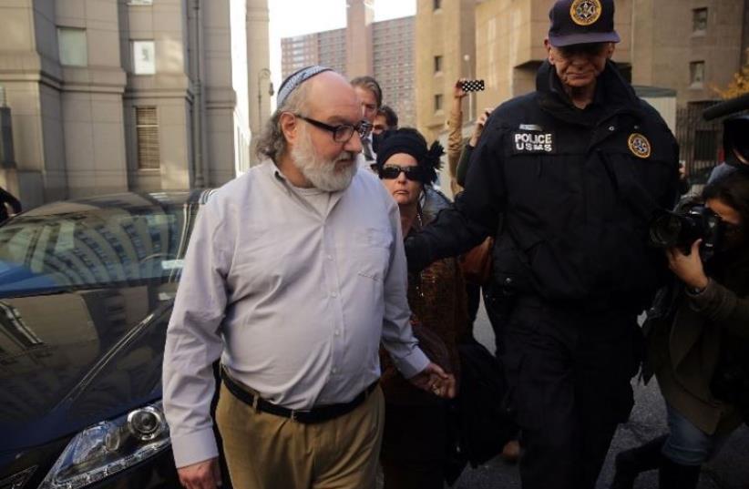 Israeli spy Jonathan Pollard leaves a federal courthouse in New York (photo credit: AFP PHOTO)