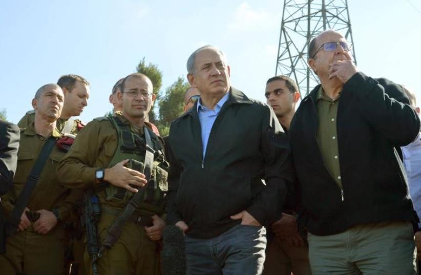 Prime Minister Benjamin Netanyahu and Defense Minister Moshe Ya'alon during a visit to the Gush Etzion Junction. (photo credit: GPO)