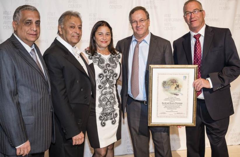  TEXAS GALA: Posing from left to right at the festive fundraiser in Dallas last week are Africa Israel’s Pini Cohen, IPO conductor Zubin Mehta, Bruria and Dudi Wiessman, and Dr. Eyran Halpern, director of the Rabin Medical Center, holding a certificate presented to him by the Weissmans (photo credit: Courtesy)