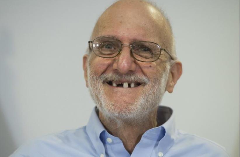 Alan Gross smiles during a press conference after being released by Cuba on December 17, 2014 in Washington,DC (photo credit: AFP PHOTO)