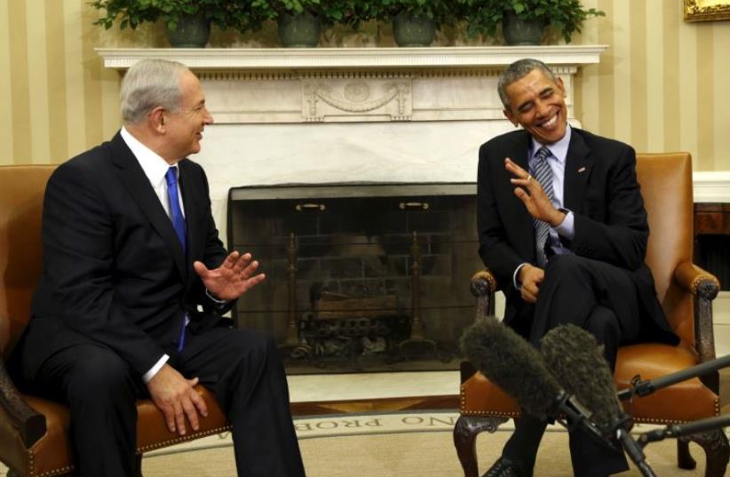 Prime Minister Benjamin Netanyahu shares a joke with US President Barack Obama during their meeting in the Oval office of the White House, in Washington (photo credit: REUTERS)
