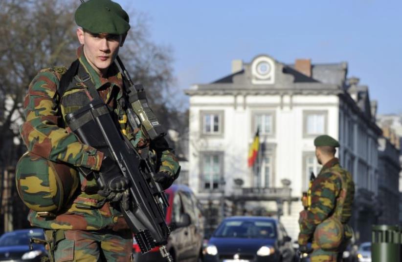 Belgian soldiers guard outside the U.S. Embassy in Brussels (photo credit: REUTERS)