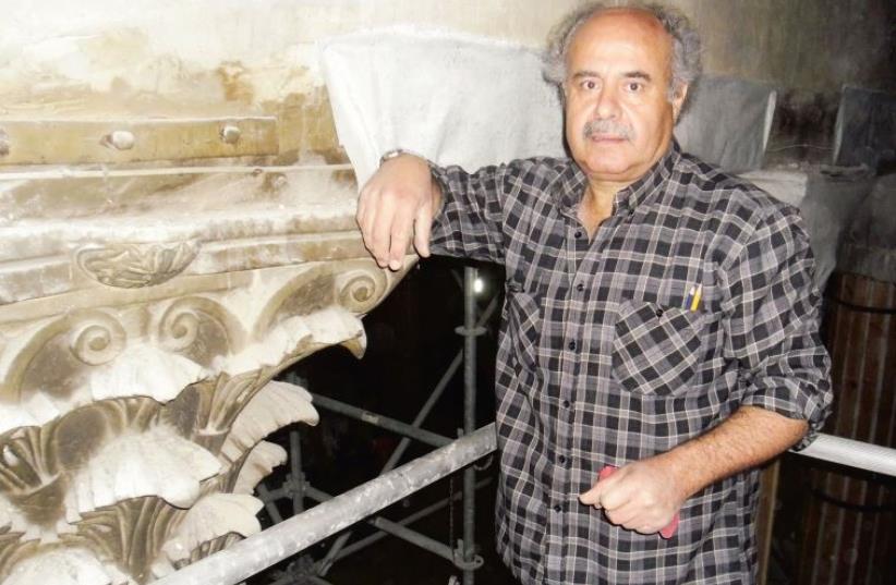 Akram Anastas next to his duplicate of a fourth-century Byzantine capital found in Bethlehem’s Church of the Nativity, for a Norwegian church (photo credit: GIL ZOHAR)