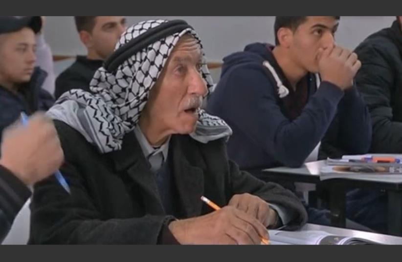 Palestinian Abed Abu Ajamiyeh, 77, is enrolled in high school classes (photo credit: REUTERS)