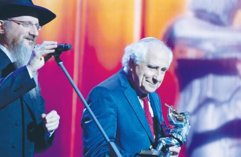 CHIEF RABBI OF RUSSIA Berel Lazar of Chabad on Tuesday presents the Fiddler on the Roof Award to human rights activist and former refusenik Yosef Begun at a Hanukka celebration in Moscow (photo credit: VADIM BRODSKY)