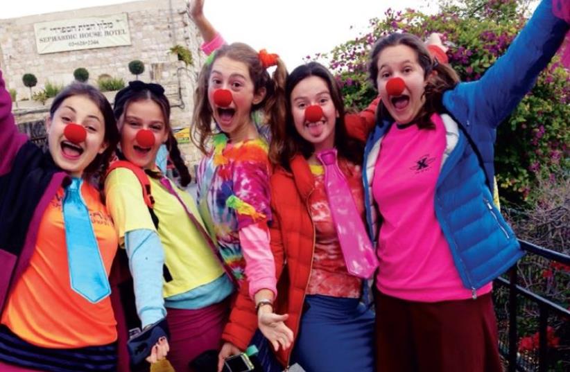 Midreshet Harova volunteers clown around (photo credit: COURTESY MIDRESHET HAROVA)