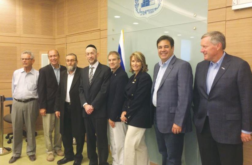 At the Knesset, Laurie Cardoza-Moore (inset) with a PJTN delegation on a recent visit with a bipartisan fivemember US Congressional delegation to Israel (photo credit: PJTN)
