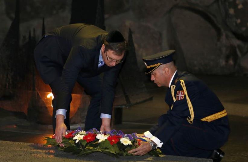 Serbia's Prime Minister Aleksandar Vucic (L) lays a wreath during a ceremony in the Hall of Remembrance at Yad Vashem Holocaust memorial in Jerusalem December 1, 2014. (photo credit: AMMAR AWAD / REUTERS)