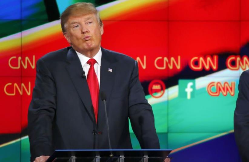 Republican US presidential candidate businessman Donald Trump reacts during the Republican presidential debate in Las Vegas, Nevada December 15, 2015. (photo credit: REUTERS/MIKE BLAKE)